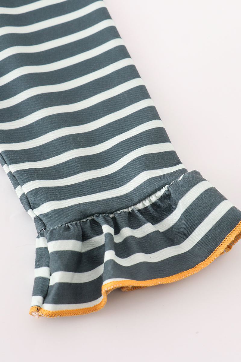 Striped fabric with ruffle edge on a white background