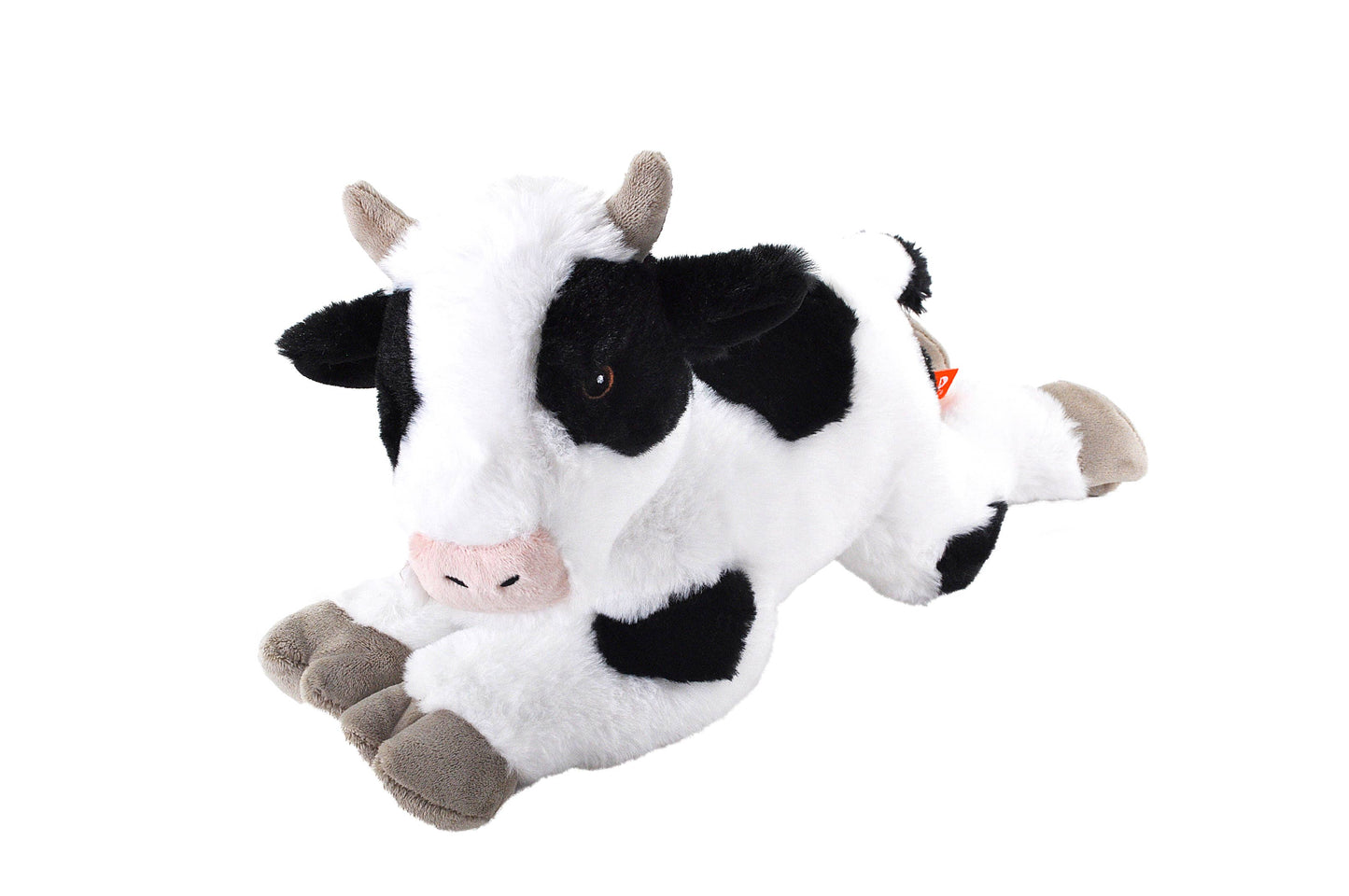Plush cow toy on a white background