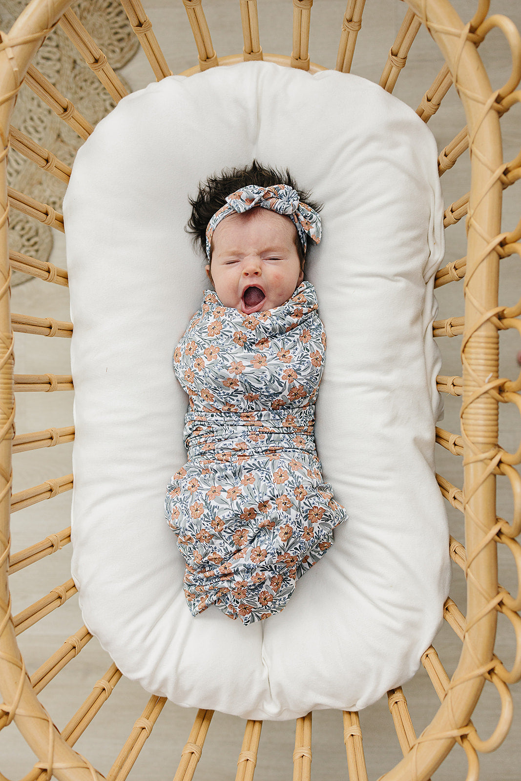 Navy floral bamboo swaddle for baby girls. a must have for newborn babies