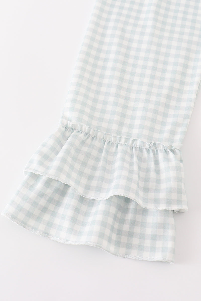 Fall toddler outfit with olive pumpkin top and gingham ruffle pants