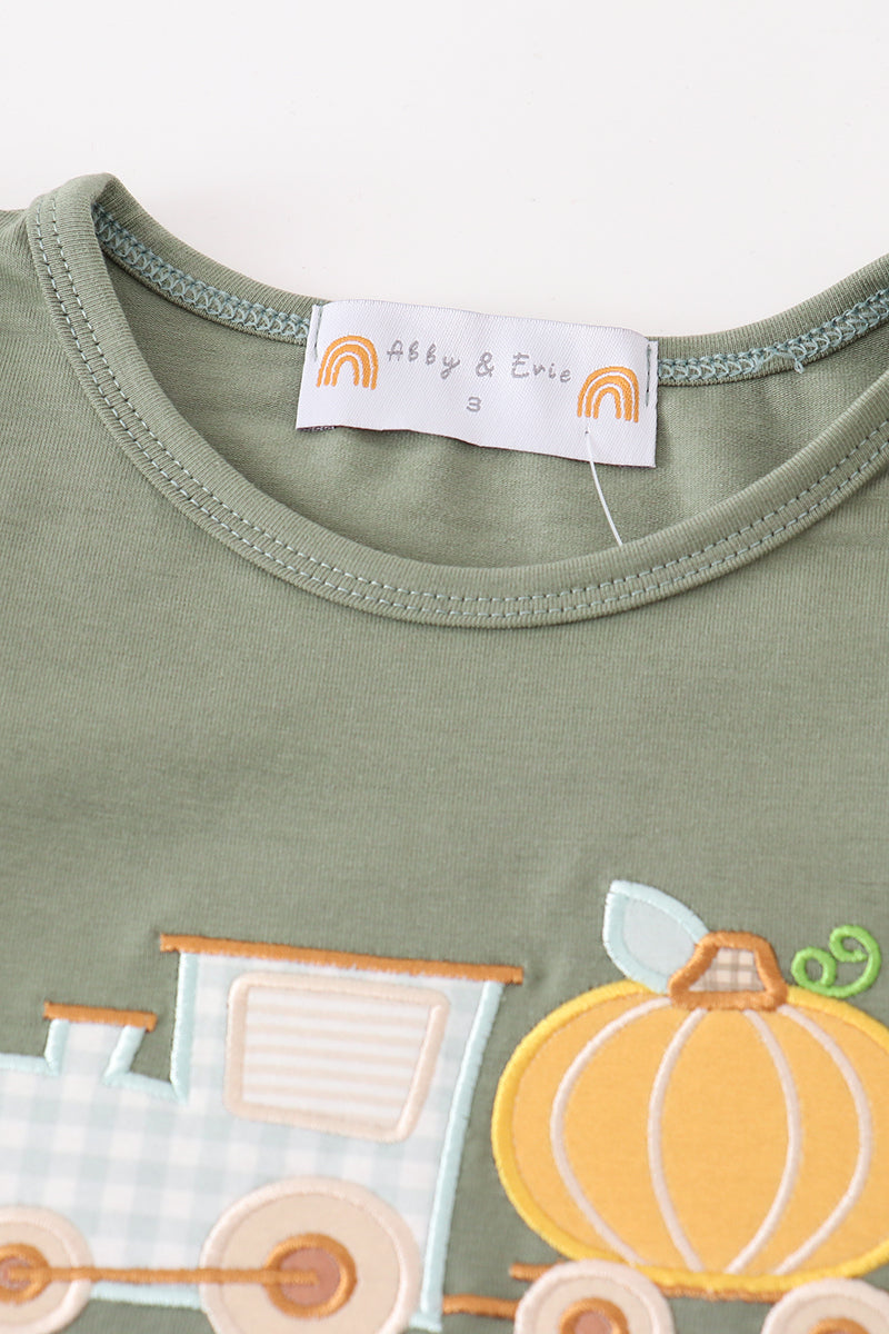 Fall toddler outfit with olive pumpkin top and gingham ruffle pants