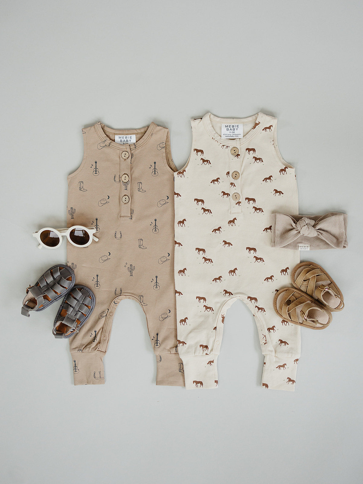 Button front sleeveless baby romper with snap closures