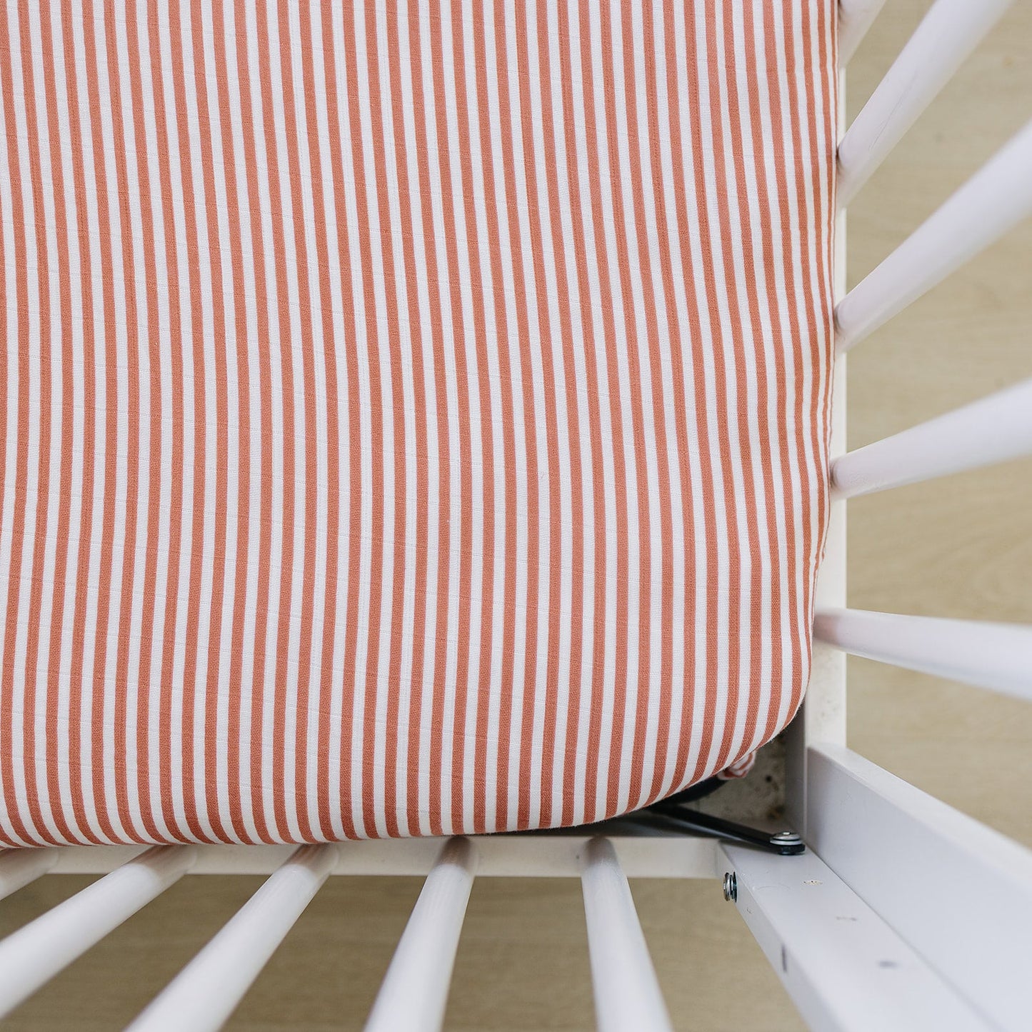Pink Stripes Muslin Crib sheet on crib - soft cotton baby bedding