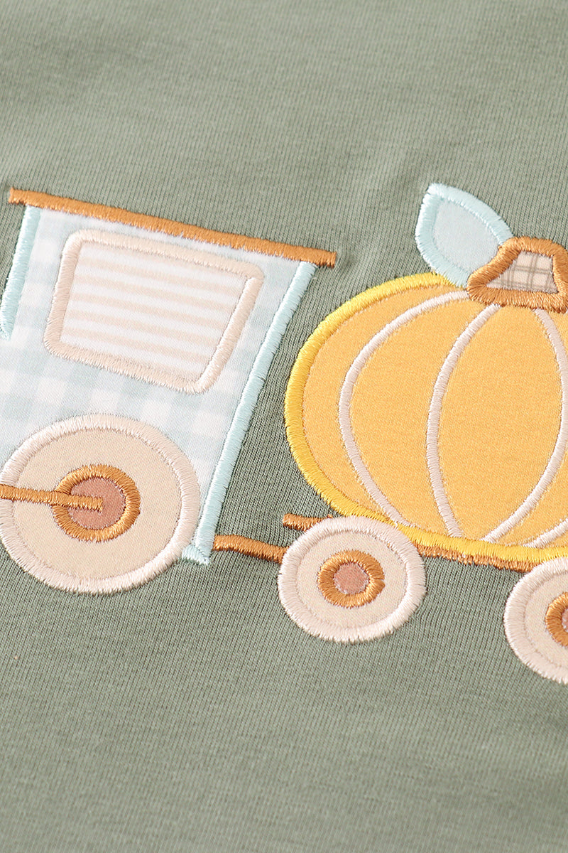 Fall toddler outfit with olive pumpkin top and gingham ruffle pants. Thanksgiving girls outfit