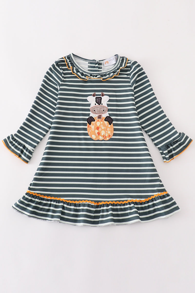Striped dress with a cow and pumpkin design on a white background