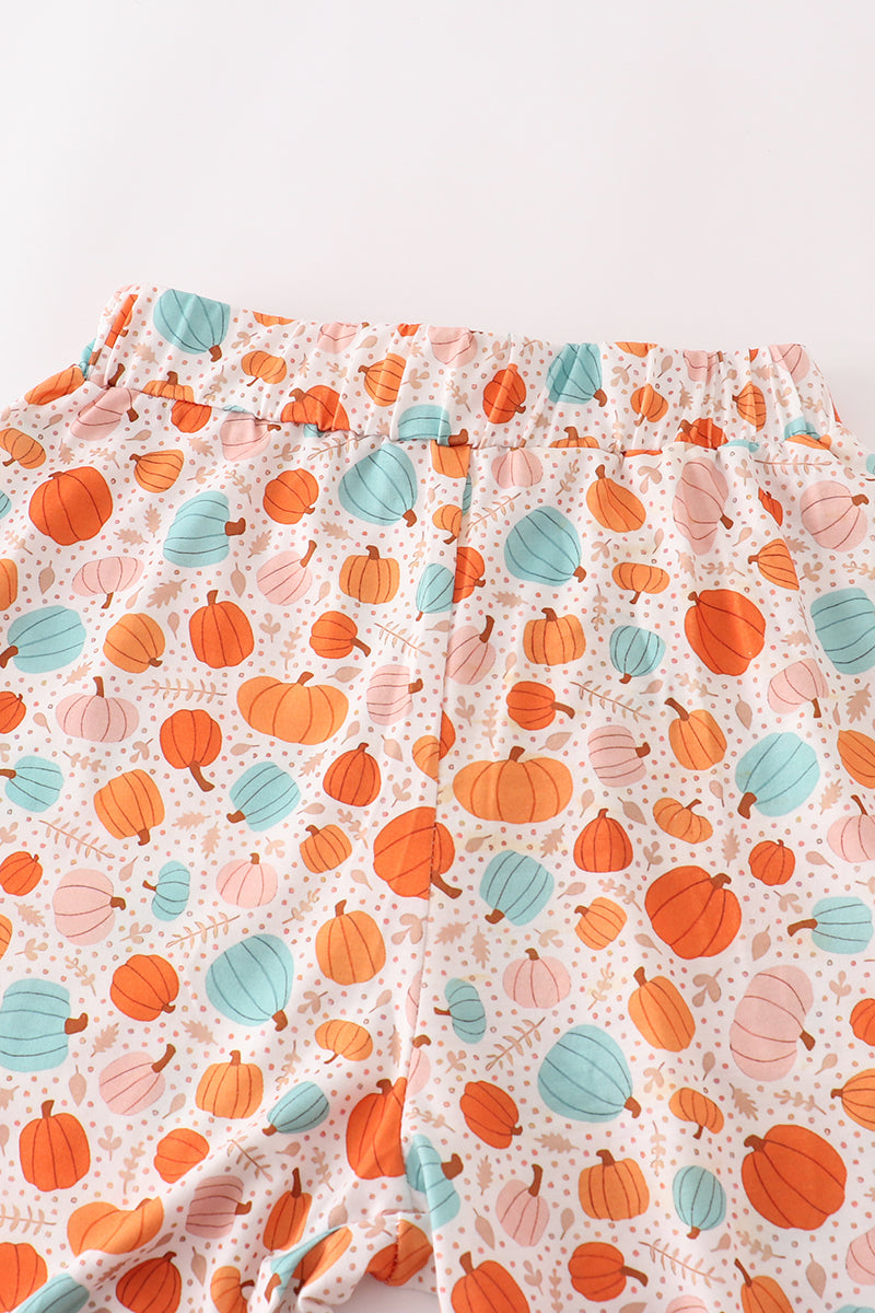pants with a colorful pumpkin pattern on a white background