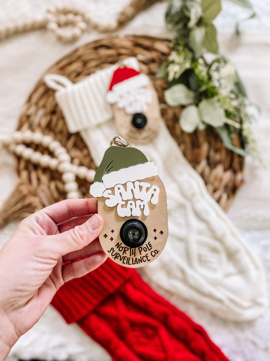 Santa Cam Wooden Ornament – Red or Green Hat | North Pole Surveillance Co.