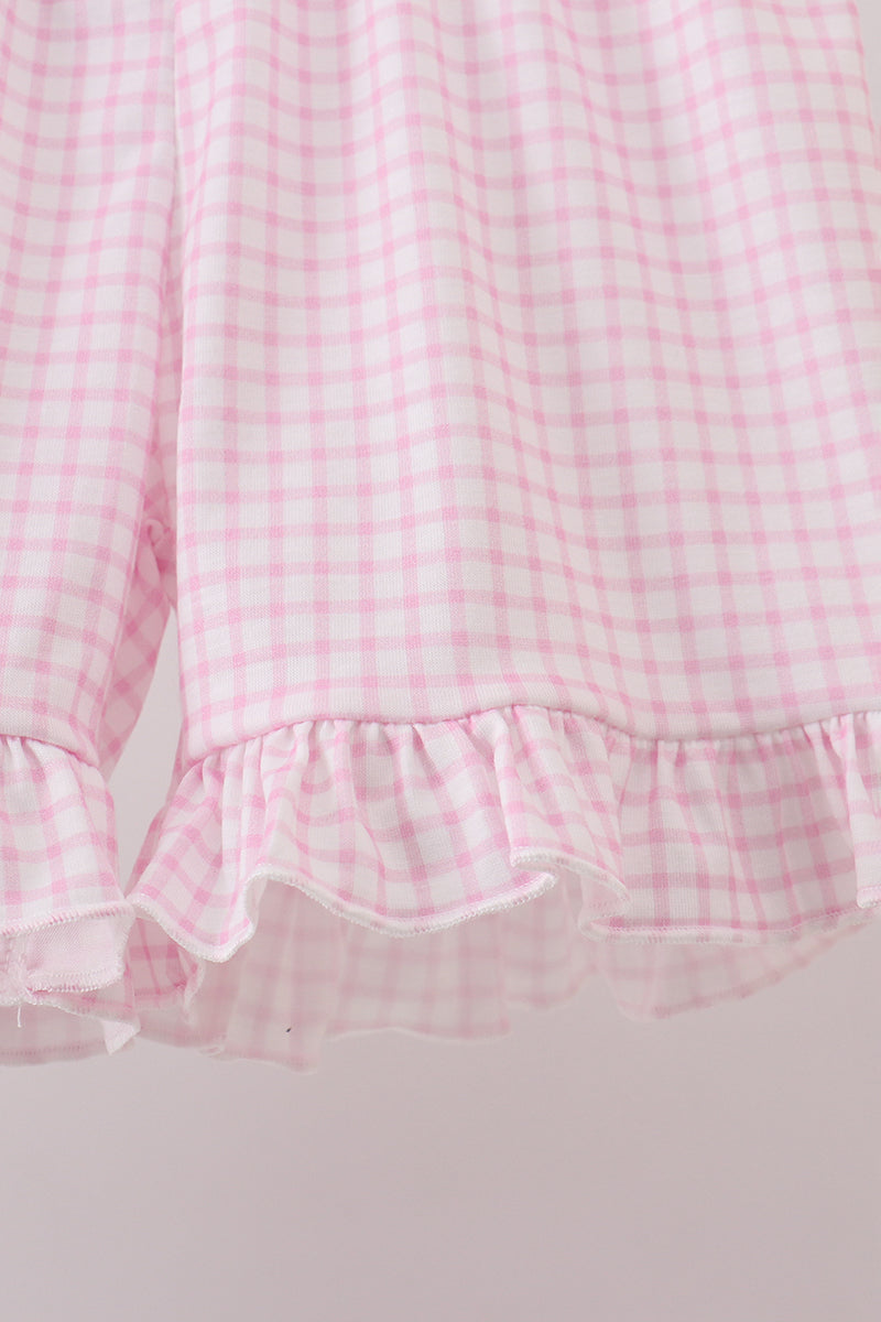 Close up detail of pink gingham shorts in farm animal outfit for toddler girls 