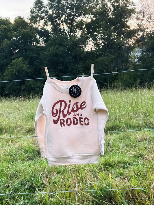 Rise and Rodeo toddler sweatshirt in heather dust, with rust graphic. fleece lined