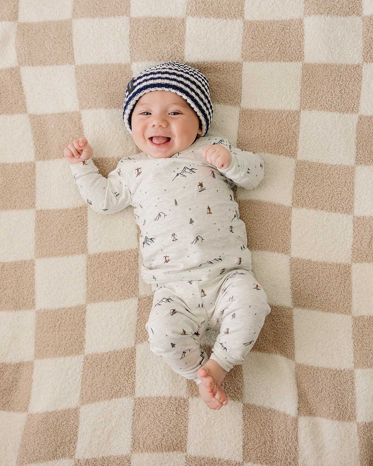 Winter baby outfit featuring snow and trees design