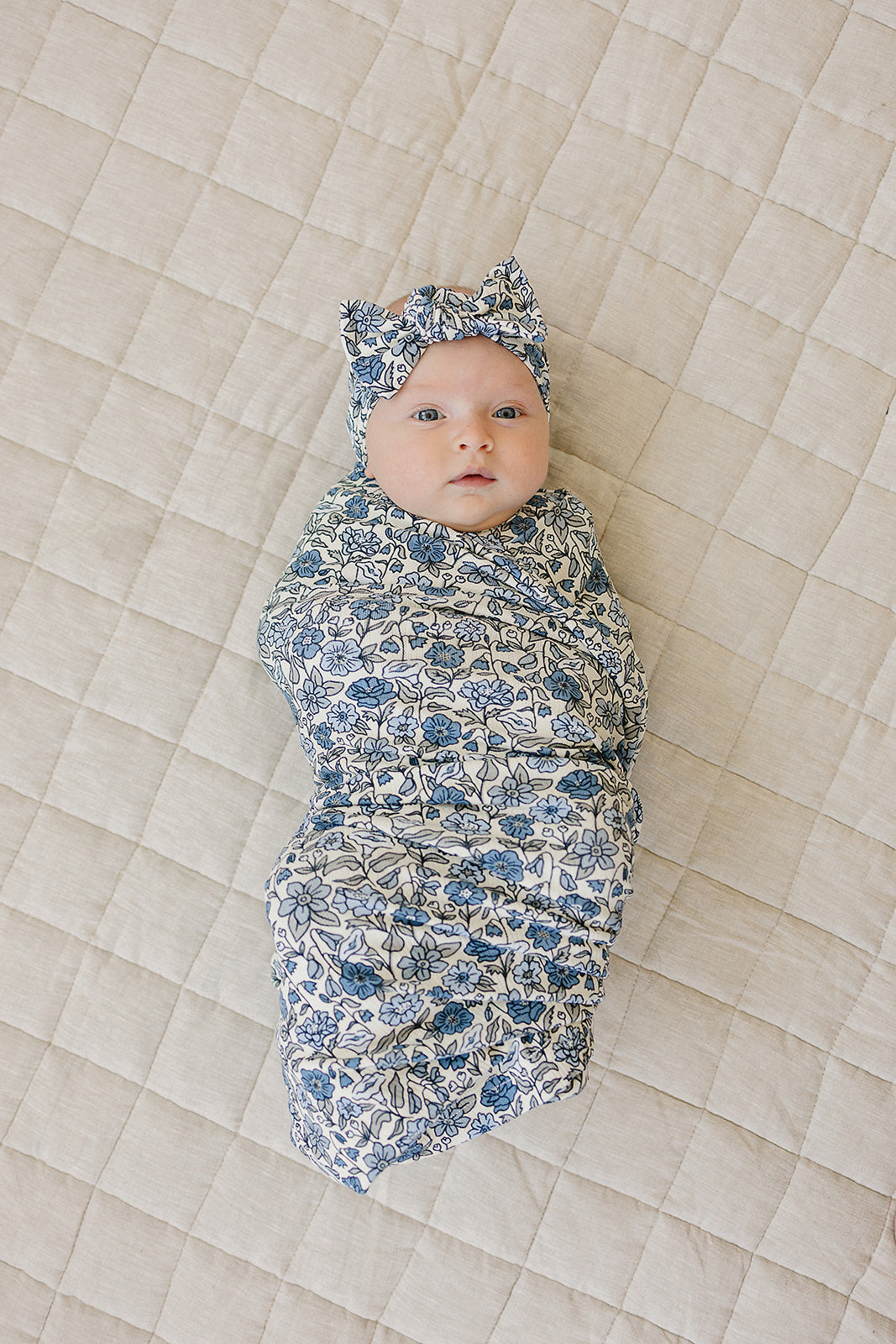 Soft stretch newborn headband with blue flower design