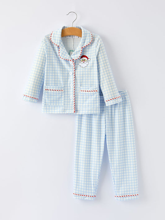 Front view of blue gingham kids Christmas pajama set with embroidered Santa and red candy-cane piping.