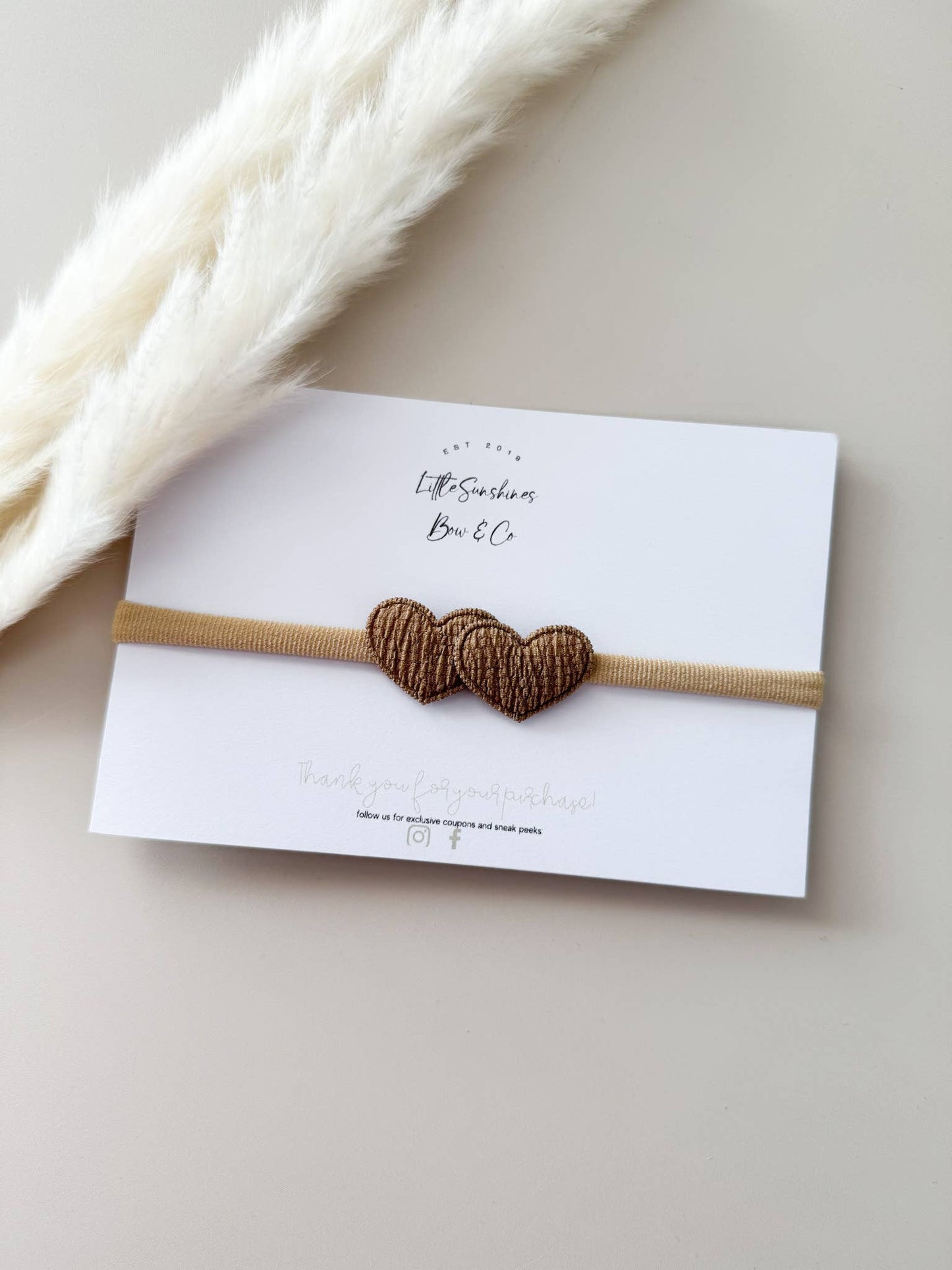 Brown heart baby headband with soft nylon band, comfortable fit for newborns through toddlers