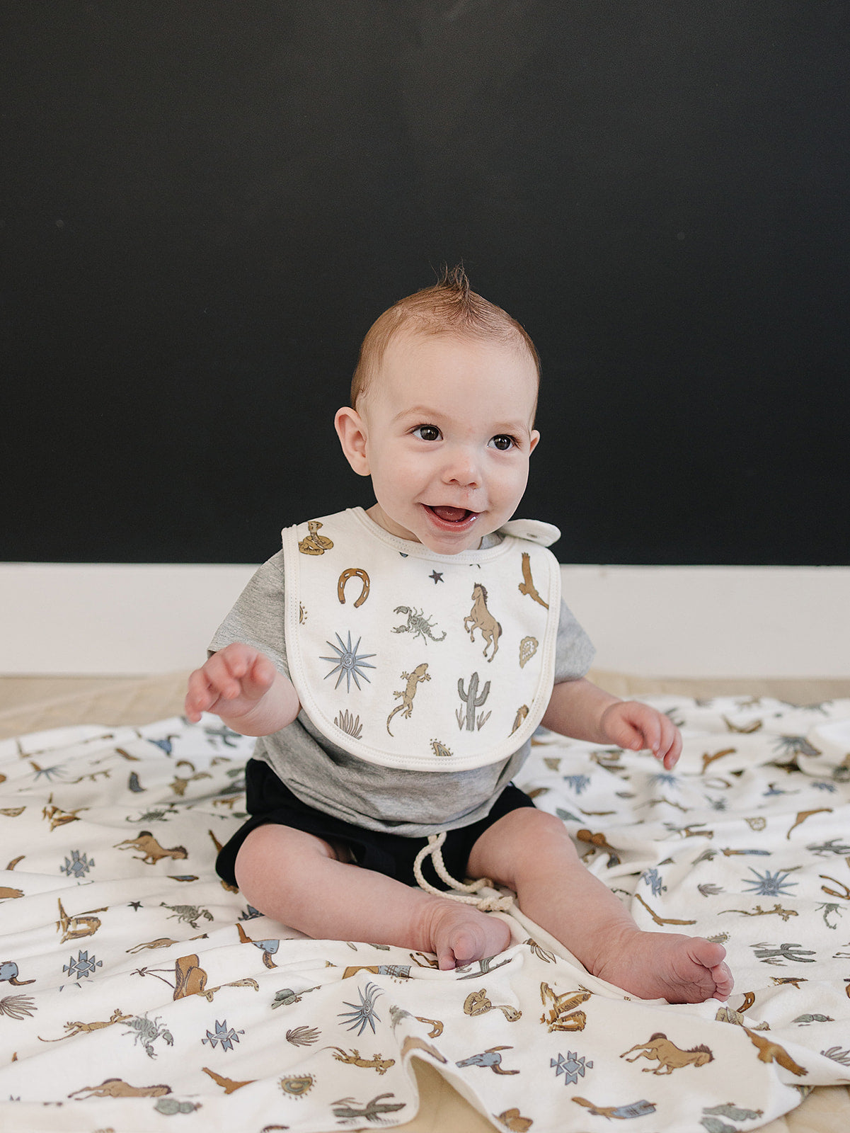 Western fleece swaddle featuring cowboy print items