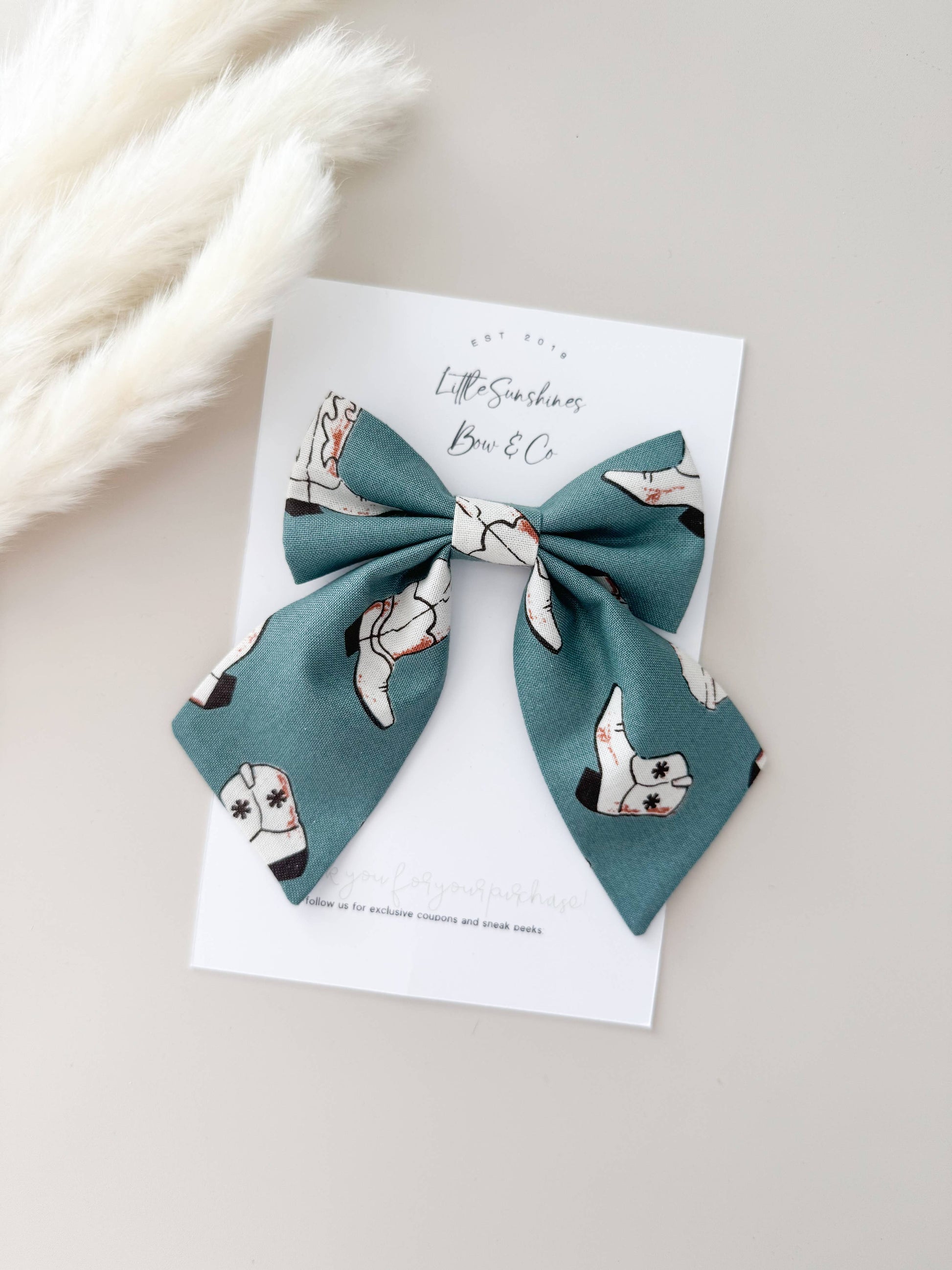 Teal cowgirl boot bow clip with western print, lightweight hair bow for girls