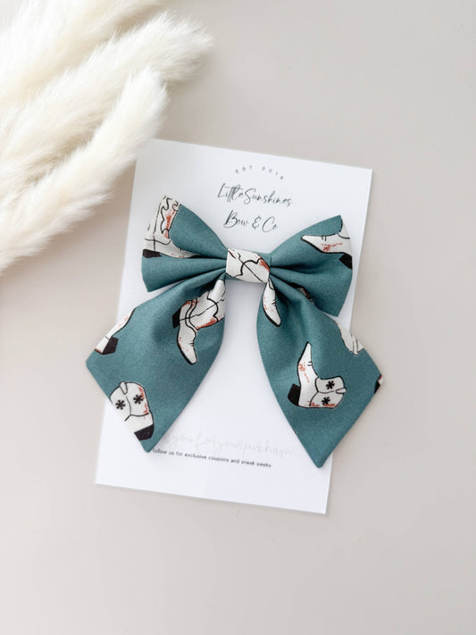 Teal cowgirl boot bow clip with western print, lightweight hair bow for girls