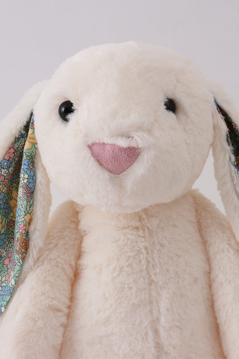 Close up of floral fabric detail on bunny ear, soft plush Easter bunny stuffed animal