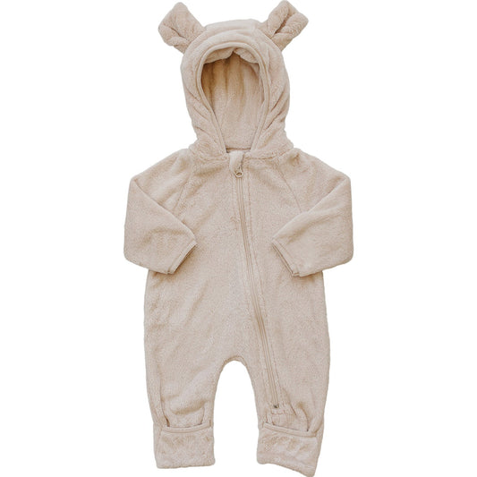 Beige baby onesie with bear ears on a white background