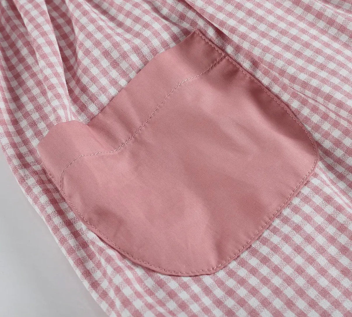 Pink pig themed twirl dress for toddlers With pocket stitching details 