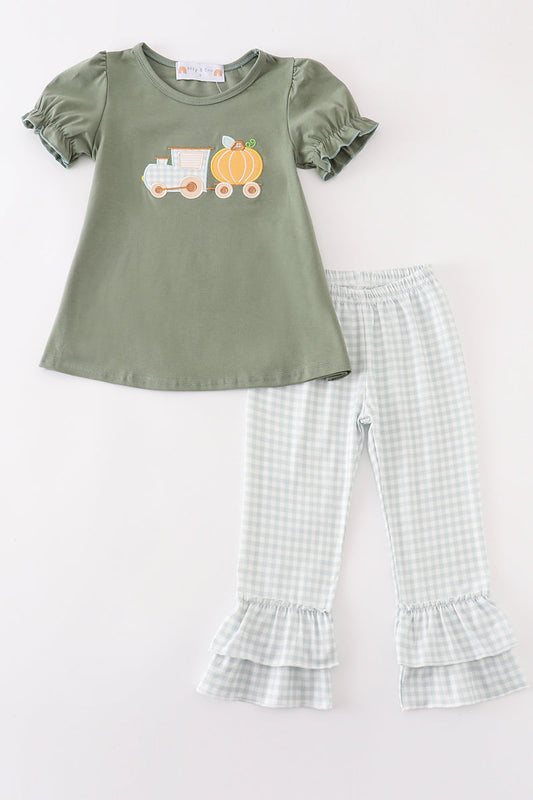 Fall toddler outfit with olive pumpkin top and gingham ruffle pants