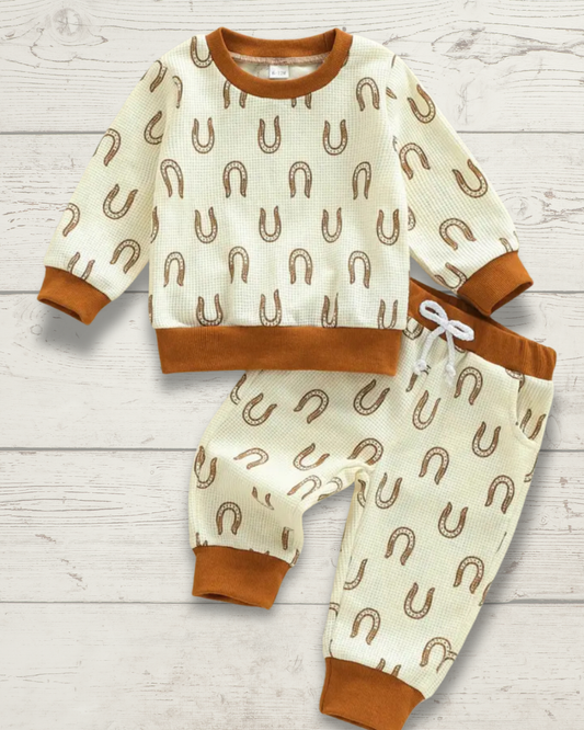 Western-inspired baby outfit with allover horseshoe pattern