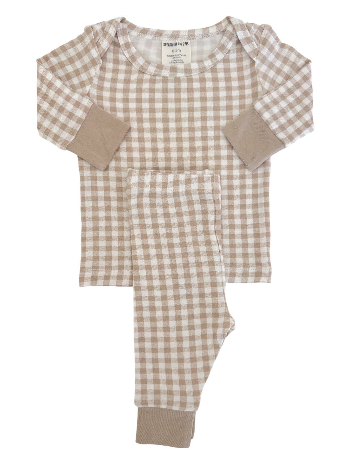 Neutral checkered baby outfit styled for boutique product photography