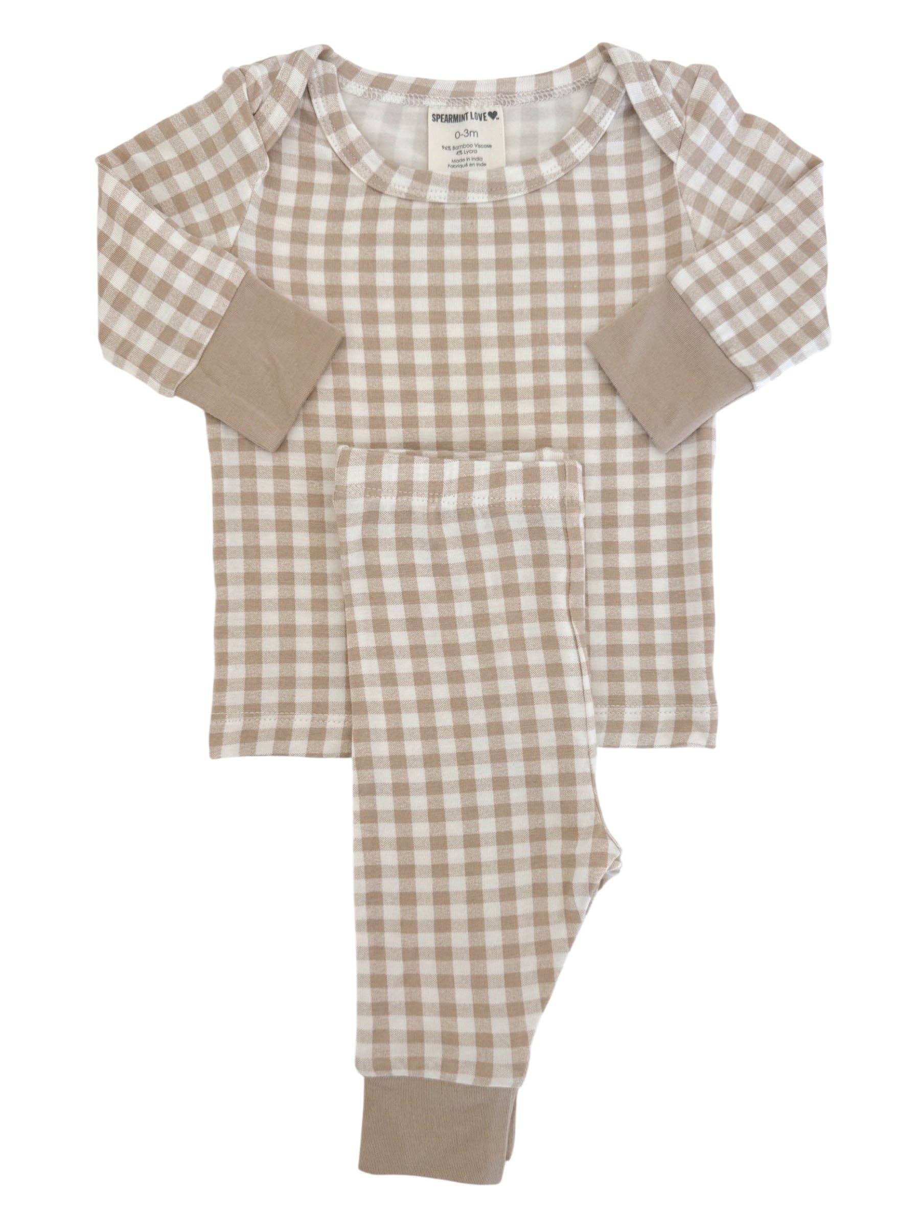 Neutral checkered baby outfit styled for boutique product photography