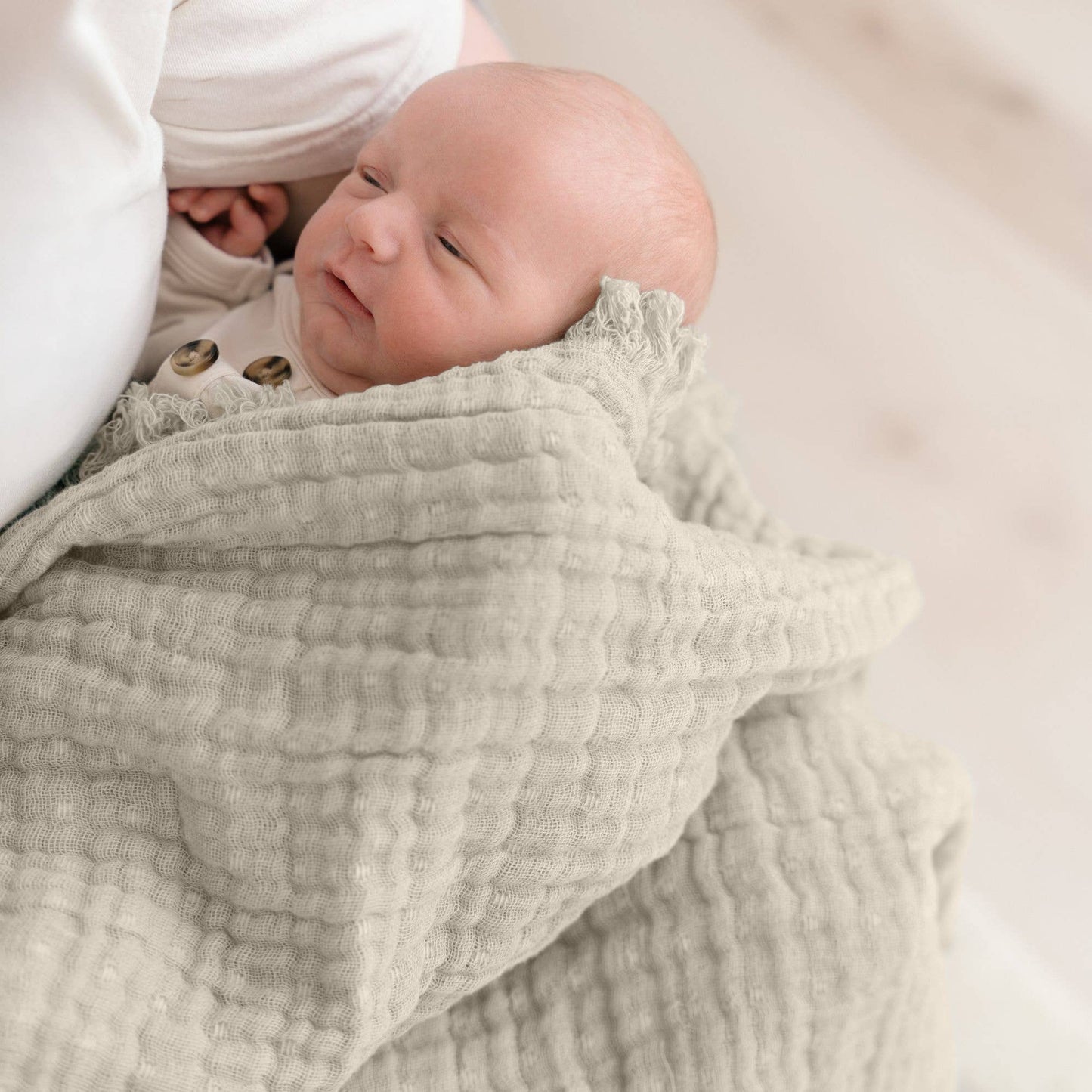 multi-layer muslin baby blanket in dove grey tones