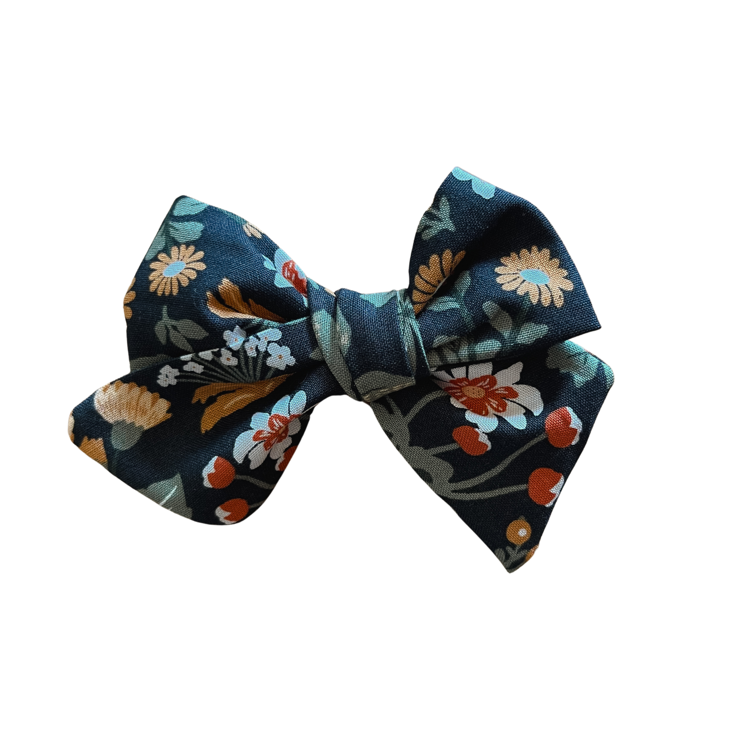 Onyx fabric with autumn floral design on a hand-tied bow on a nude nylon band