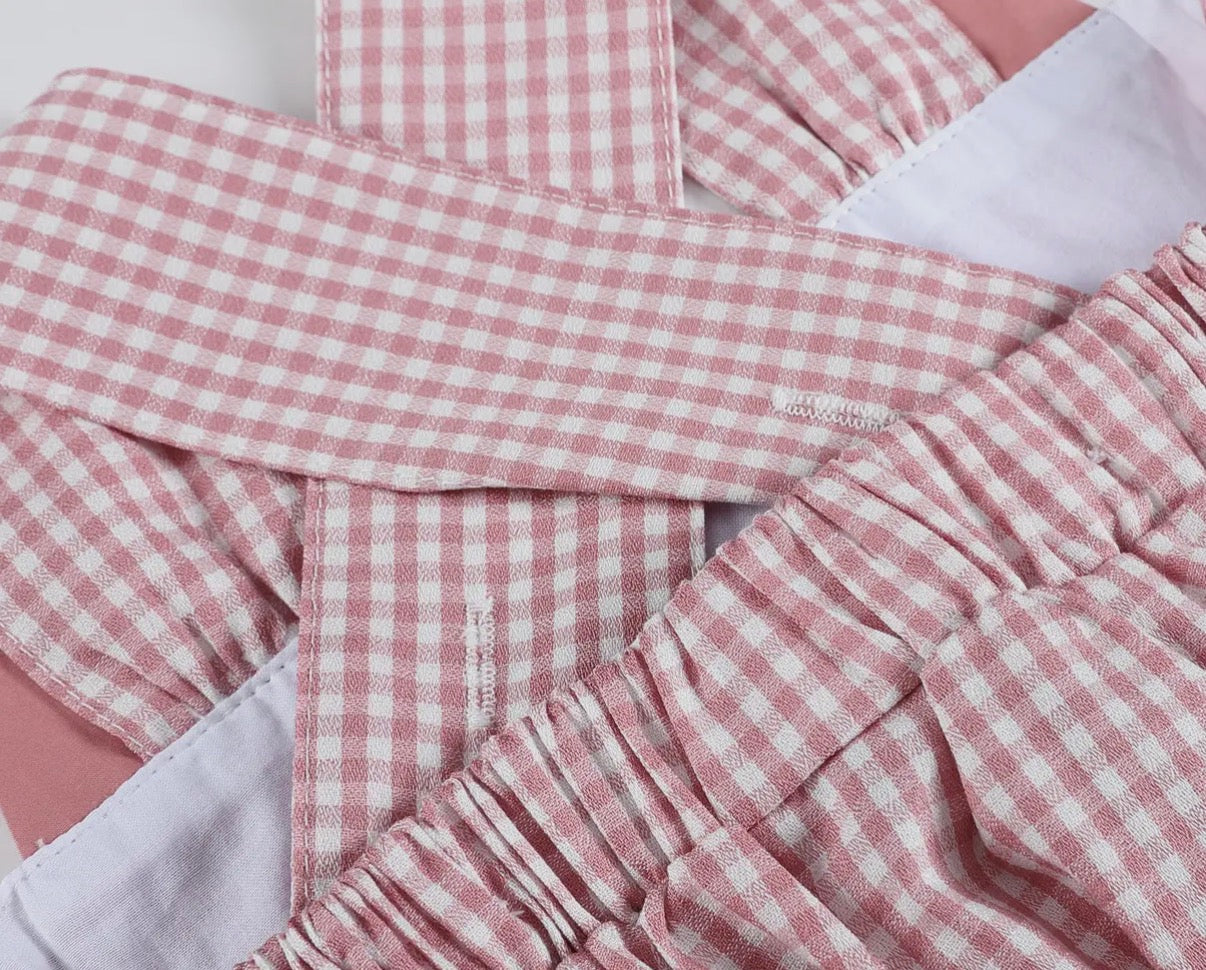 Boutique girls gingham dress with animal detail and adjustable criss cross back
Strap detail 
