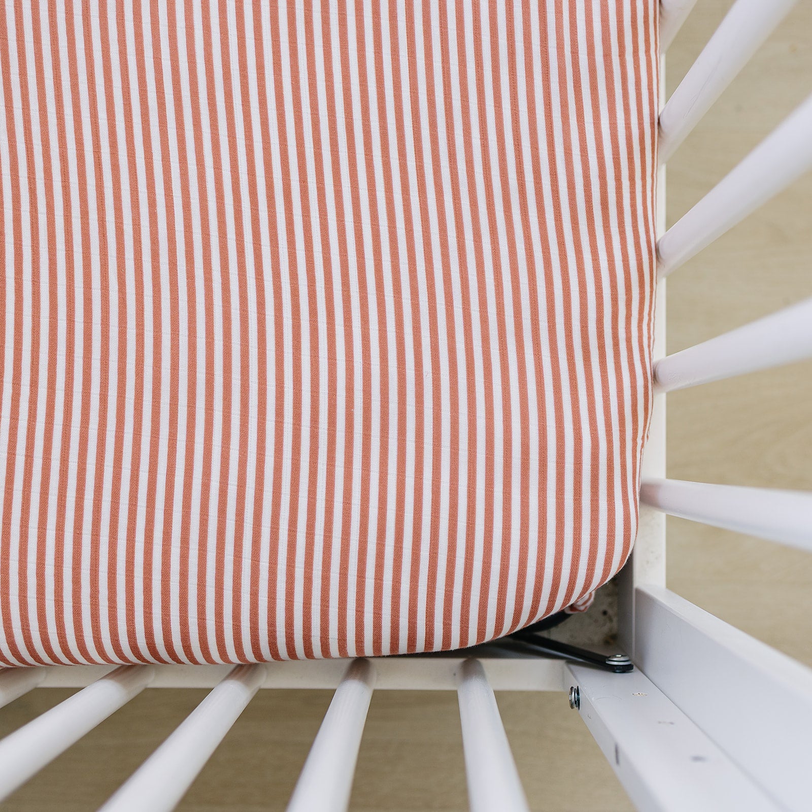 Pink Stripes Muslin Crib sheet on crib - soft cotton baby bedding