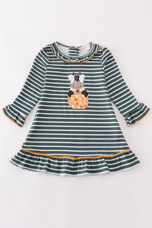 Striped dress with a cow and pumpkin design on a white background