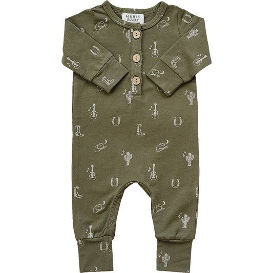 Green baby romper with western patterns on a white background